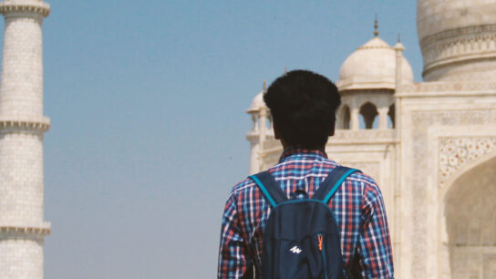 A student looking at the Taj Mahal.