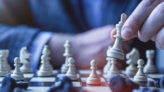 A Man playing chess.