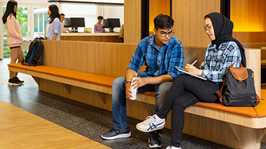 Students sitting in campus reception