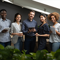 group of smiling professionals in office