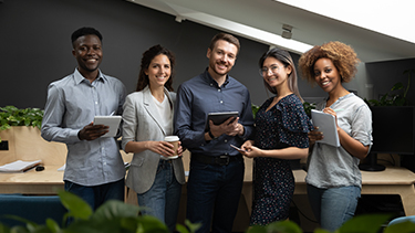 group of smiling professionals in office