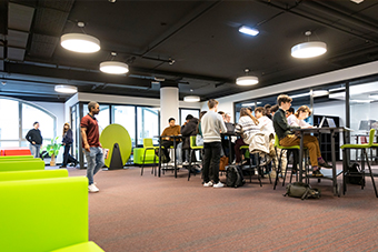 Group of students in campus lunch breakout area