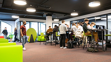 Group of students in campus lunch breakout area