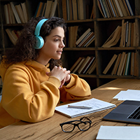 student studying alone in library