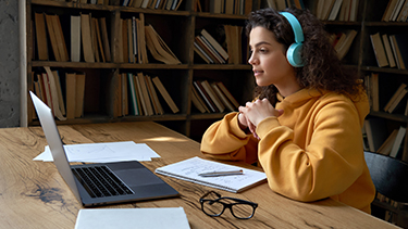 student studying alone in library