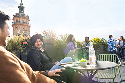 Students relaxing on rooftop in Leipzig