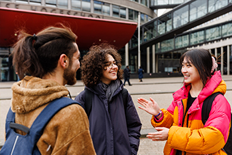 Students talking in campus square