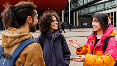 Students talking in campus square