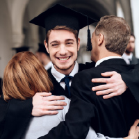 Graduating student hugging parents