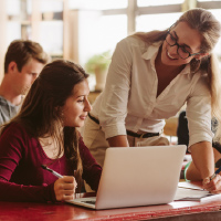 Teacher providing student with assistance