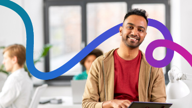 Student similing in classroom surrounded by digital colour ribbon