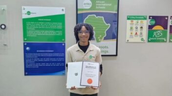 A proud winner from Enko Maputo, Mozambique, with their SAE Certificate of Achievement and Apple prize