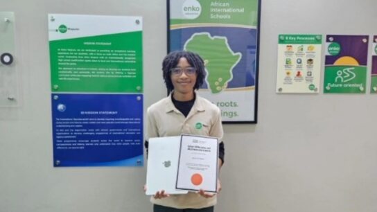 A proud winner from Enko Maputo, Mozambique, with their SAE Certificate of Achievement and Apple prize